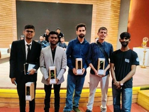 Sarthak Mittal receiving recognition with global delegates