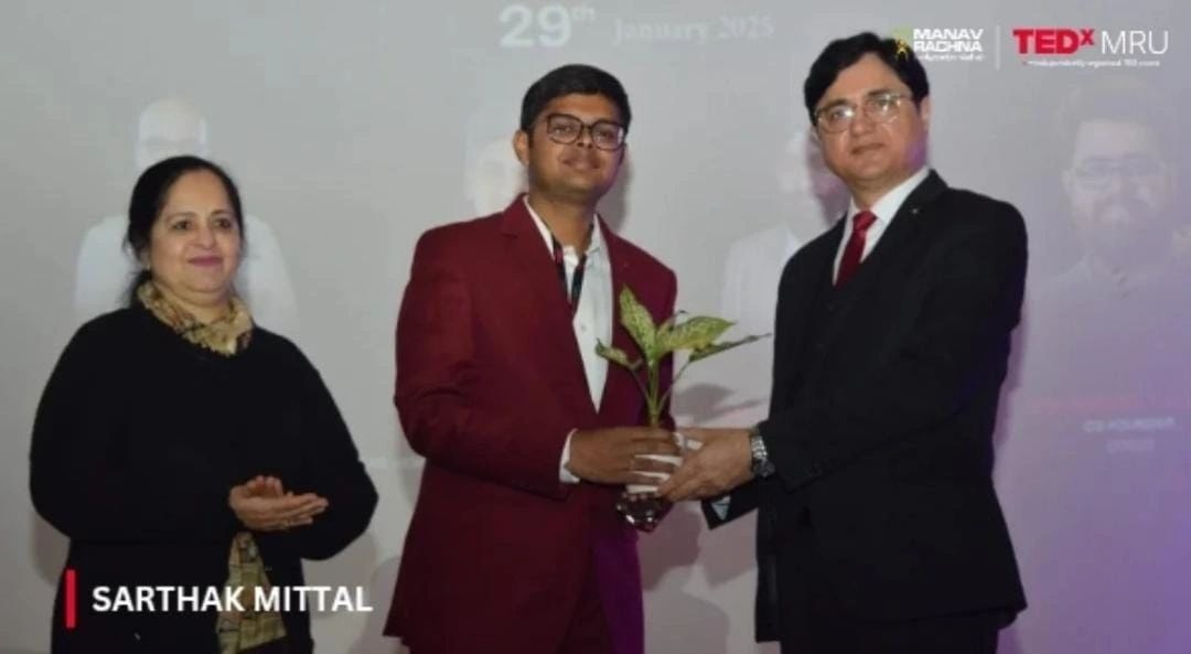 Sarthak Mittal receiving award at TEDx
